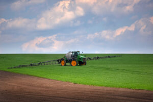 tractor-spraying-green-wheat-field-agricultural-globalgap